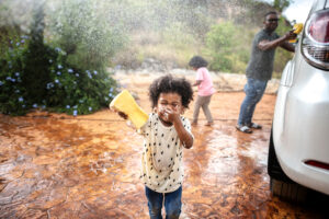 Family washing their car